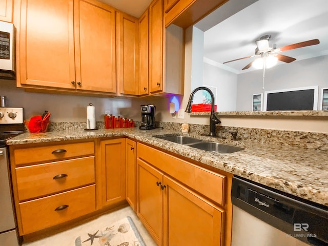 kitchen with sink, stainless steel appliances, light stone countertops, and ceiling fan