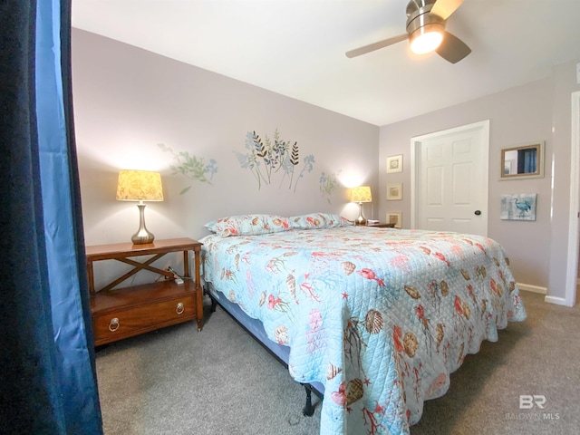 bedroom featuring ceiling fan and carpet