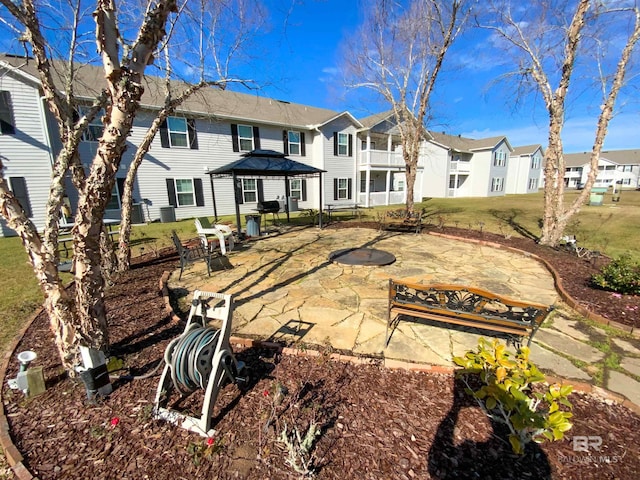 back of house featuring a patio area and a gazebo