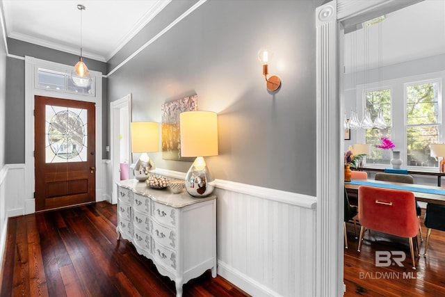 foyer featuring dark hardwood / wood-style flooring and ornamental molding