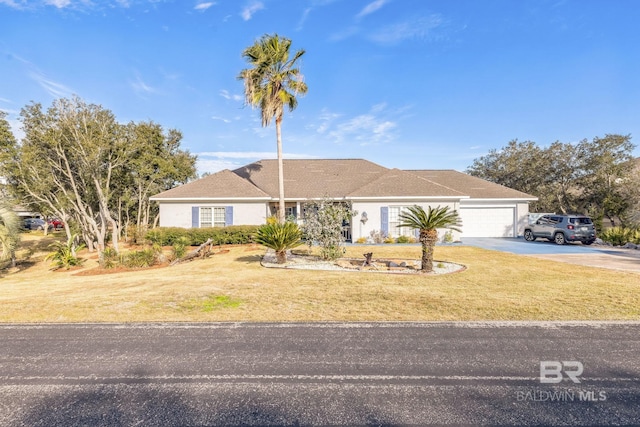 ranch-style house with a front yard and a garage