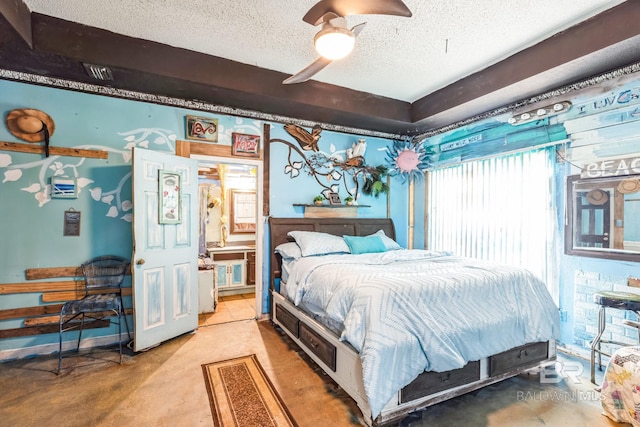 bedroom featuring ceiling fan, a textured ceiling, and ensuite bath