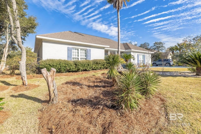 view of home's exterior featuring a lawn