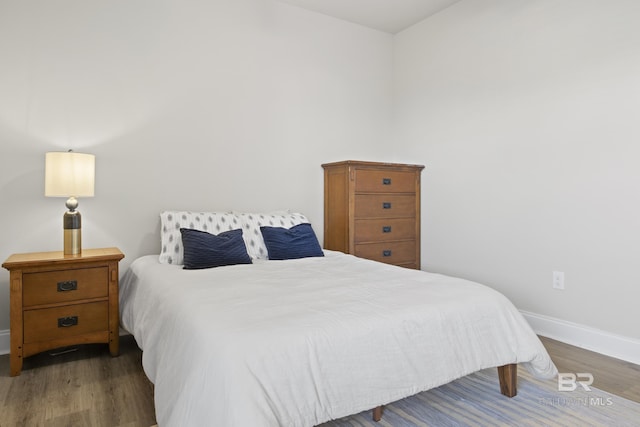 bedroom featuring dark wood-type flooring