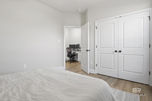 bedroom featuring a closet and light hardwood / wood-style flooring