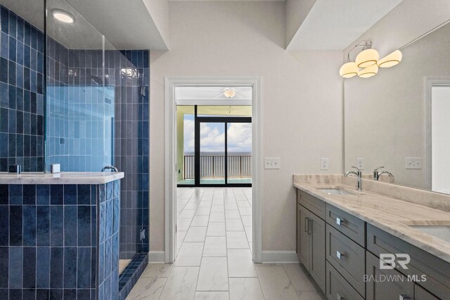 533 E Beach Blvd Unit 2403, Gulf Shores, AL 36542 - bathroom with marble finish floors, tiled shower, and double vanity