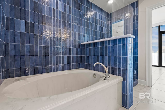 533 E Beach Blvd Unit 2403, Gulf Shores, AL 36542 - full bathroom featuring tiled shower, a bath, tile walls, and marble finish floors