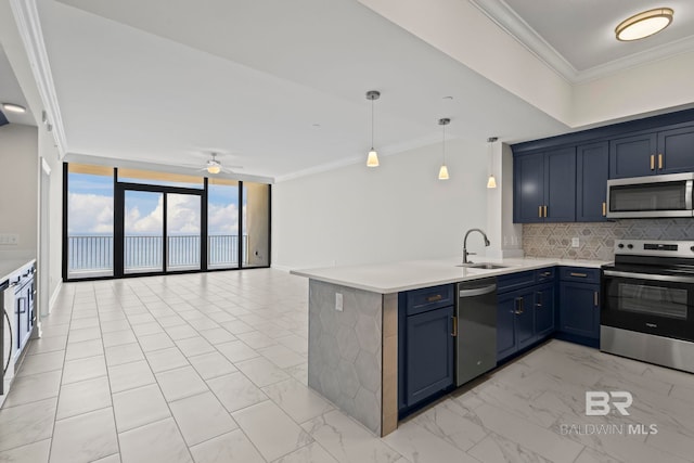 533 E Beach Blvd Unit 2403, Gulf Shores, AL 36542 - kitchen with appliances with stainless steel finishes, expansive windows, blue cabinets, a peninsula, and tasteful backsplash