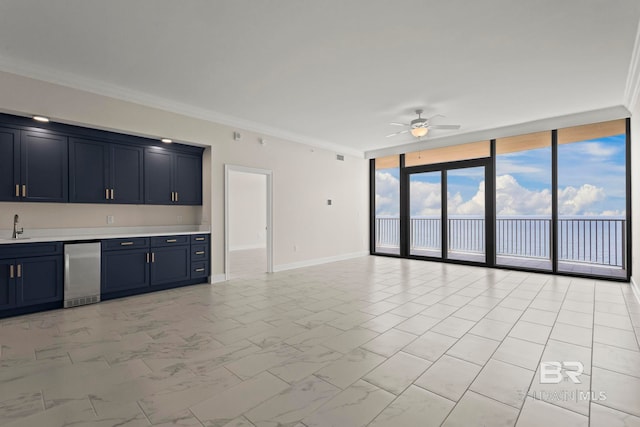 533 E Beach Blvd Unit 2403, Gulf Shores, AL 36542 - unfurnished living room with expansive windows, a ceiling fan, ornamental molding, and light marble finish floors
