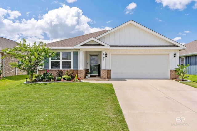 craftsman-style home featuring a front yard and a garage