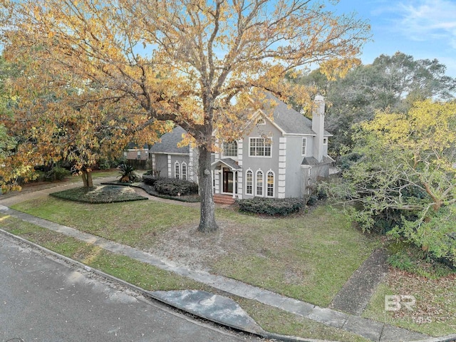 view of front of home with a front yard