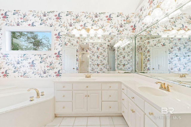 bathroom featuring vanity, tile patterned flooring, and a tub