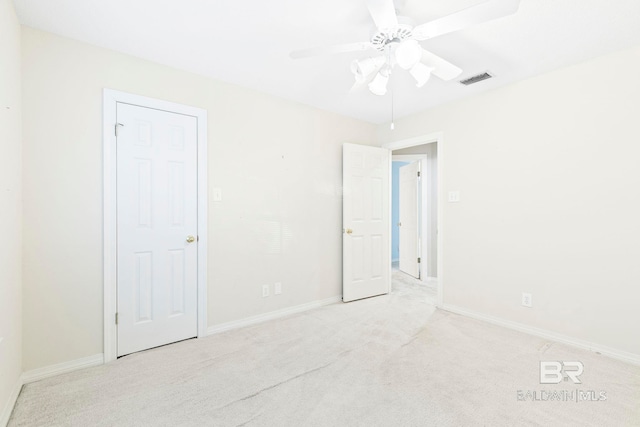 carpeted empty room with ceiling fan