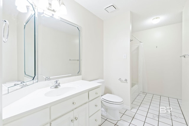 full bathroom with tile patterned flooring, vanity, a textured ceiling, toilet, and shower / bath combo with shower curtain