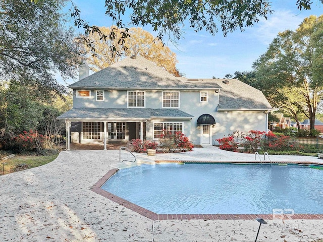 back of property with a patio