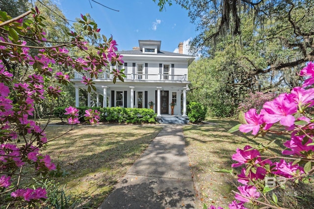 2550 Springhill Ave, Mobile, AL 36607 - italianate house featuring a porch, a chimney, and a balcony