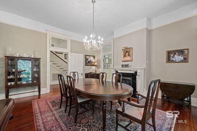 2550 Springhill Ave, Mobile, AL 36607 - dining room featuring stairway, wood finished floors, an inviting chandelier, a fireplace, and baseboards