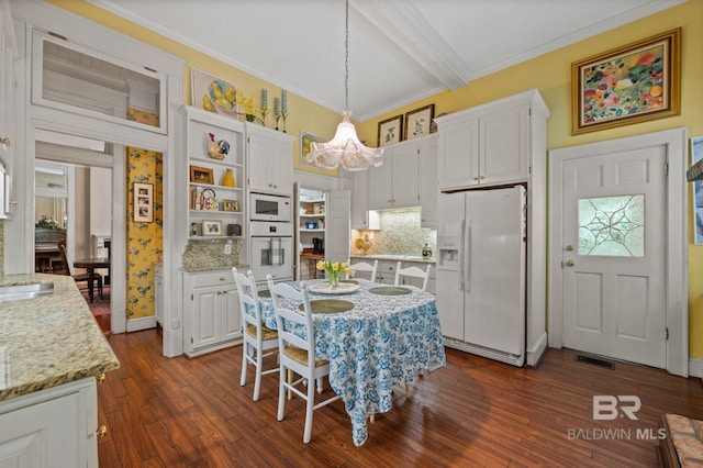 2550 Springhill Ave, Mobile, AL 36607 - dining space featuring dark wood finished floors, visible vents, beam ceiling, crown molding, and a notable chandelier
