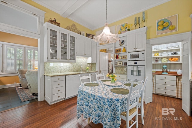 2550 Springhill Ave, Mobile, AL 36607 - kitchen with white cabinets, an inviting chandelier, open shelves, and white appliances