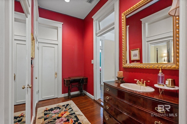 2550 Springhill Ave, Mobile, AL 36607 - bathroom with baseboards, vanity, wood finished floors, and visible vents