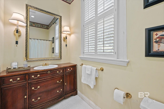 2550 Springhill Ave, Mobile, AL 36607 - bathroom featuring vanity, tile patterned flooring, and baseboards