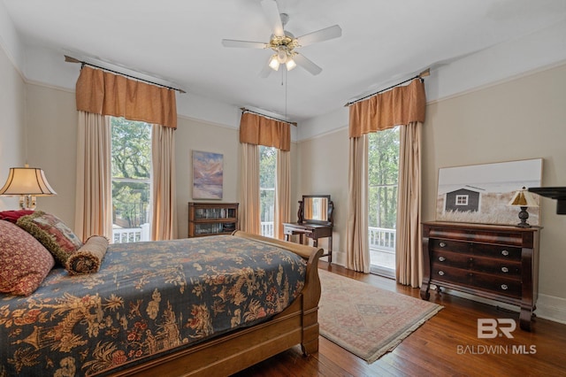 2550 Springhill Ave, Mobile, AL 36607 - bedroom featuring a ceiling fan, wood finished floors, access to outside, and multiple windows