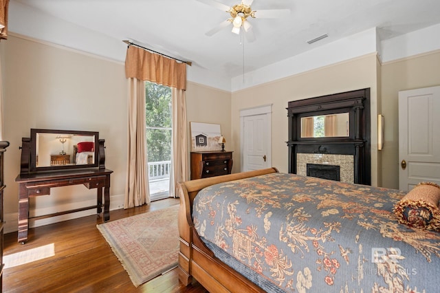 2550 Springhill Ave, Mobile, AL 36607 - bedroom with baseboards, wood finished floors, visible vents, and access to exterior