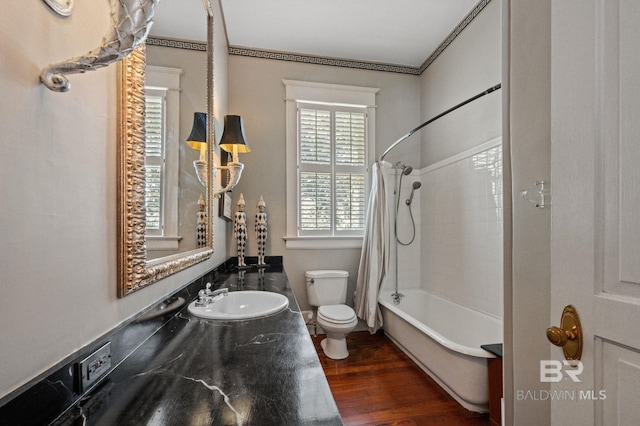 2550 Springhill Ave, Mobile, AL 36607 - bathroom featuring shower / bath combo with shower curtain, wood finished floors, a sink, and toilet