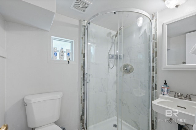2550 Springhill Ave, Mobile, AL 36607 - full bath with visible vents, a sink, a shower stall, and toilet