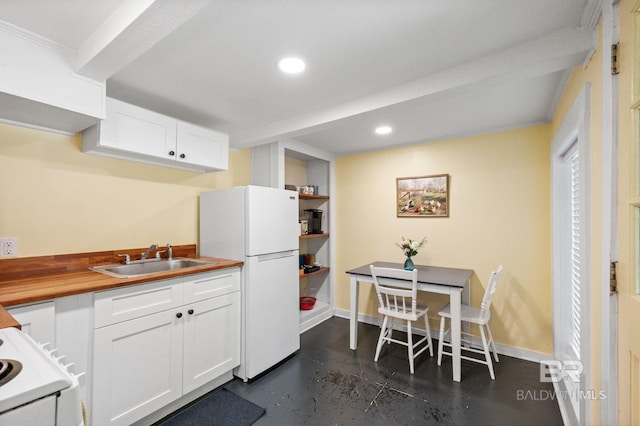2550 Springhill Ave, Mobile, AL 36607 - kitchen with white cabinets, white appliances, a sink, butcher block counters, and finished concrete flooring