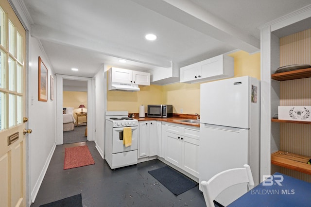 2550 Springhill Ave, Mobile, AL 36607 - kitchen featuring concrete flooring, white cabinetry, white appliances, and baseboards