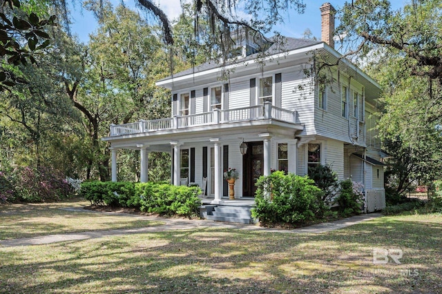 2550 Springhill Ave, Mobile, AL 36607 - italianate house featuring a front lawn, a porch, a chimney, and a balcony