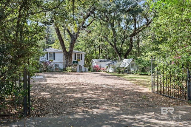 2550 Springhill Ave, Mobile, AL 36607 - view of yard with a gate, dirt driveway, and fence