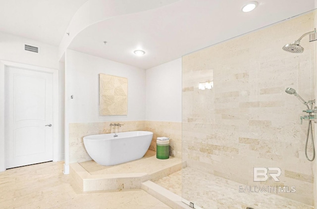 bathroom with separate shower and tub