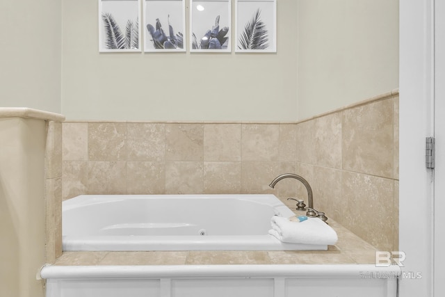 bathroom featuring a tub with jets