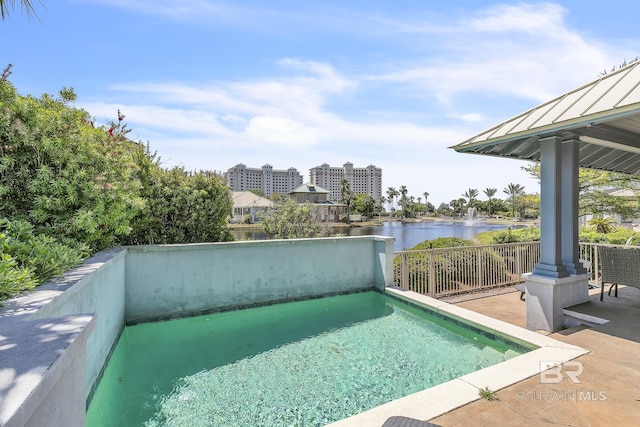 view of pool featuring a water view