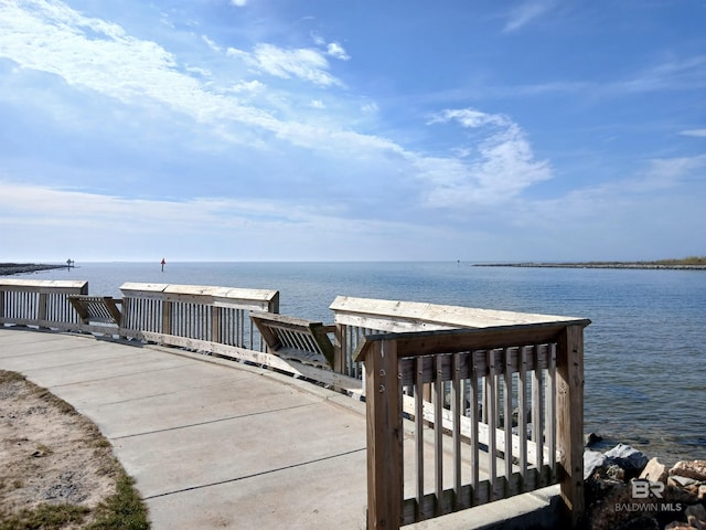 surrounding community featuring a water view