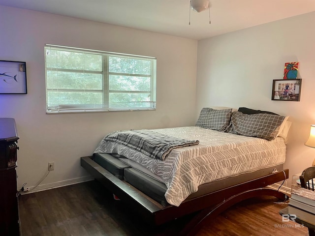 bedroom with dark wood-type flooring and ceiling fan