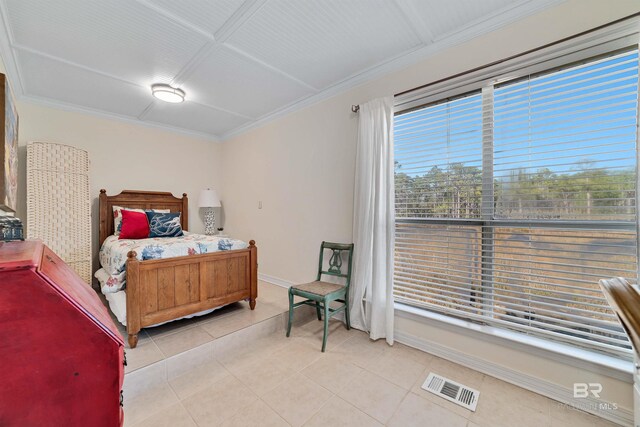 bedroom featuring visible vents, crown molding, baseboards, and light tile patterned floors