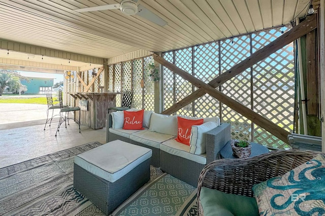 view of patio featuring outdoor lounge area, ceiling fan, and outdoor dry bar