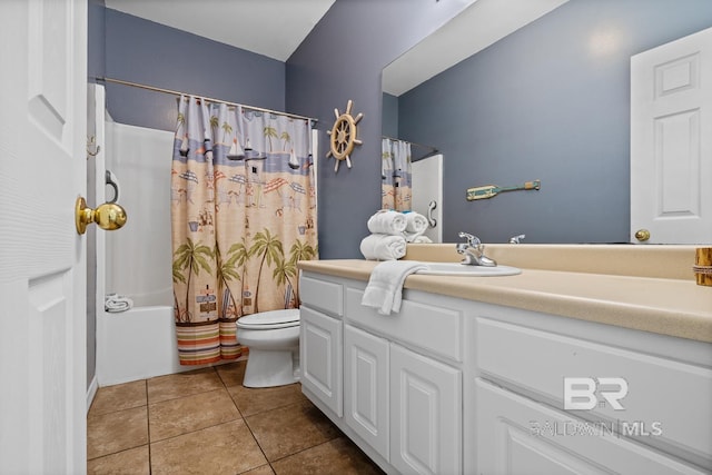 full bathroom featuring tile patterned floors, shower / bath combo with shower curtain, vanity, and toilet