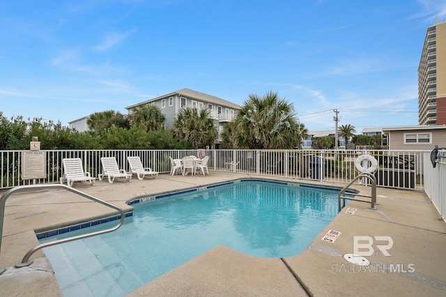 view of swimming pool with a patio area