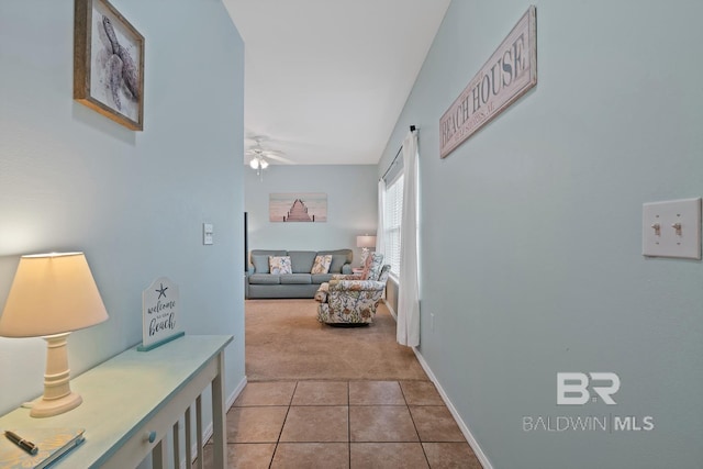 hallway with light colored carpet