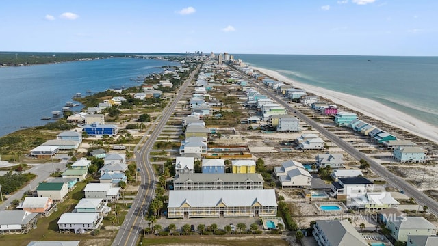 birds eye view of property featuring a water view and a view of the beach