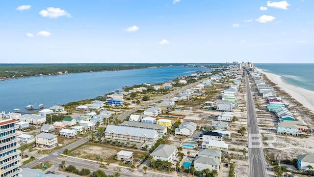 aerial view featuring a water view and a beach view