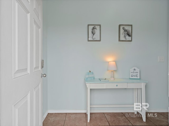 hall featuring light tile patterned flooring