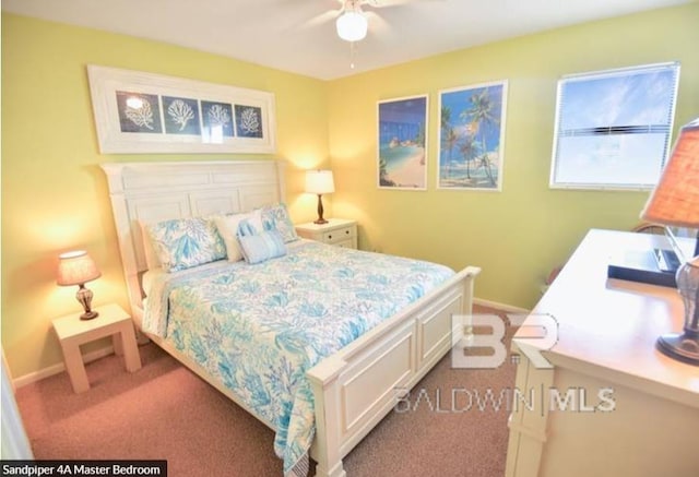 1069 W Beach Blvd Unit 4-A, Gulf Shores, AL 36542 - bedroom with carpet flooring and ceiling fan