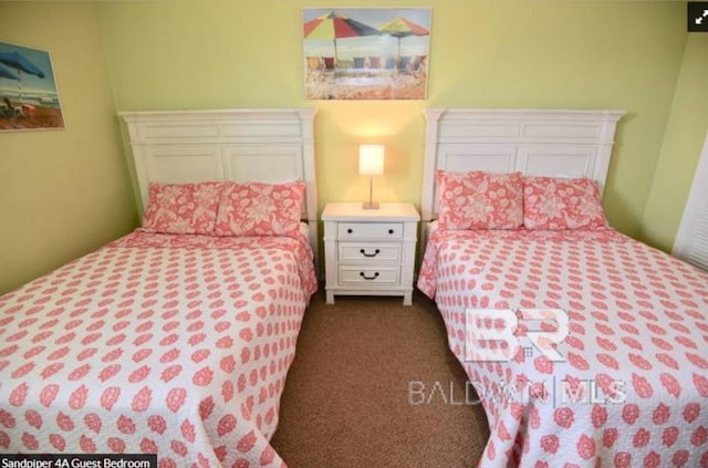 1069 W Beach Blvd Unit 4-A, Gulf Shores, AL 36542 - bedroom featuring dark colored carpet