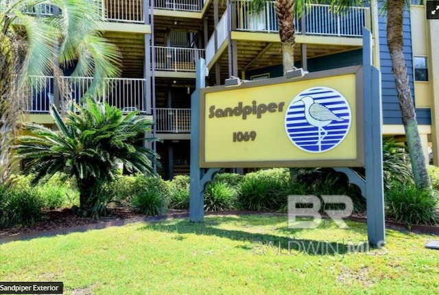 1069 W Beach Blvd Unit 4-A, Gulf Shores, AL 36542 - community / neighborhood sign featuring a lawn