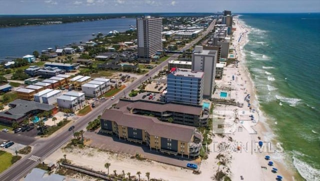 drone / aerial view featuring a view of the beach and a water view